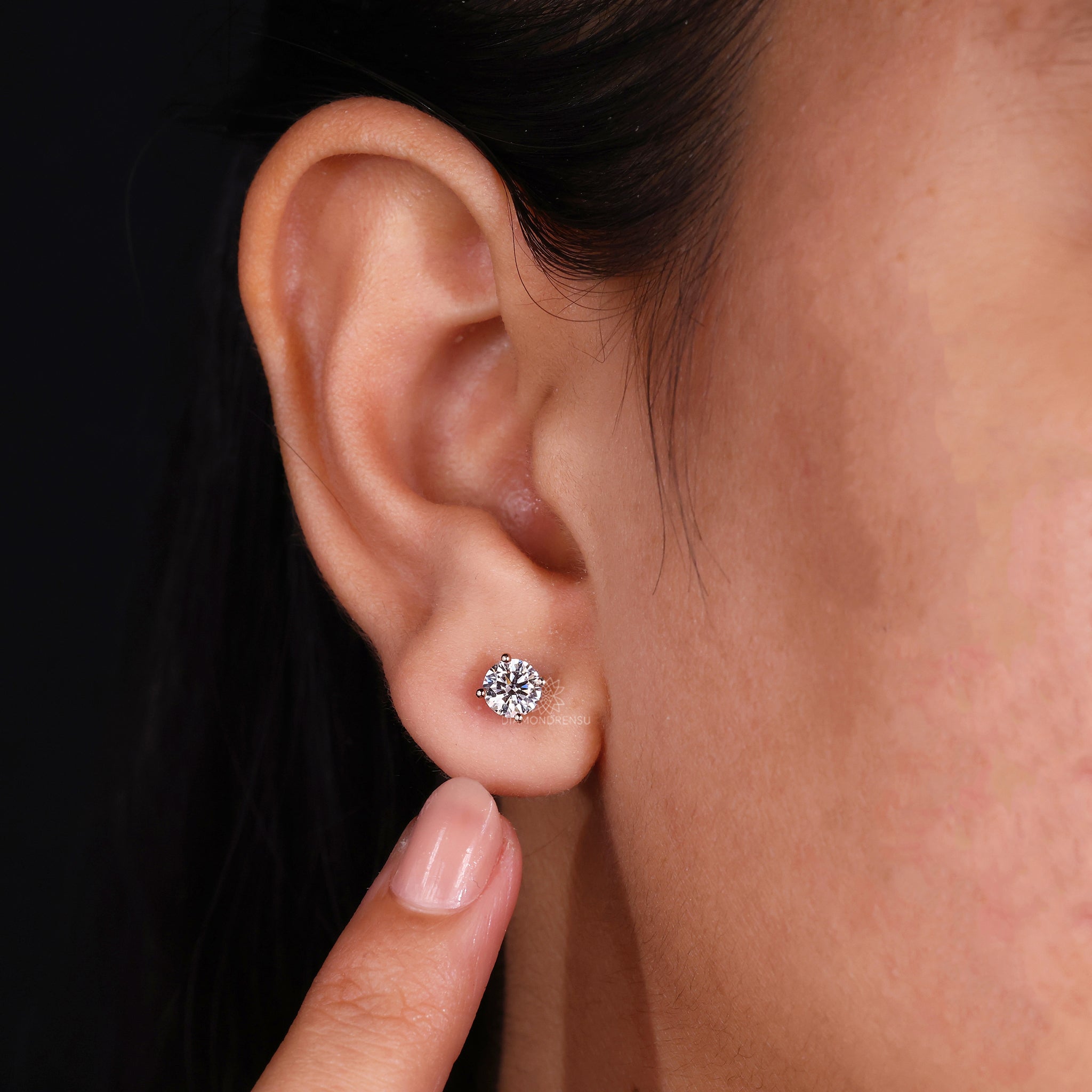 Diamond stud earrings UK with classic rose gold prong setting.
