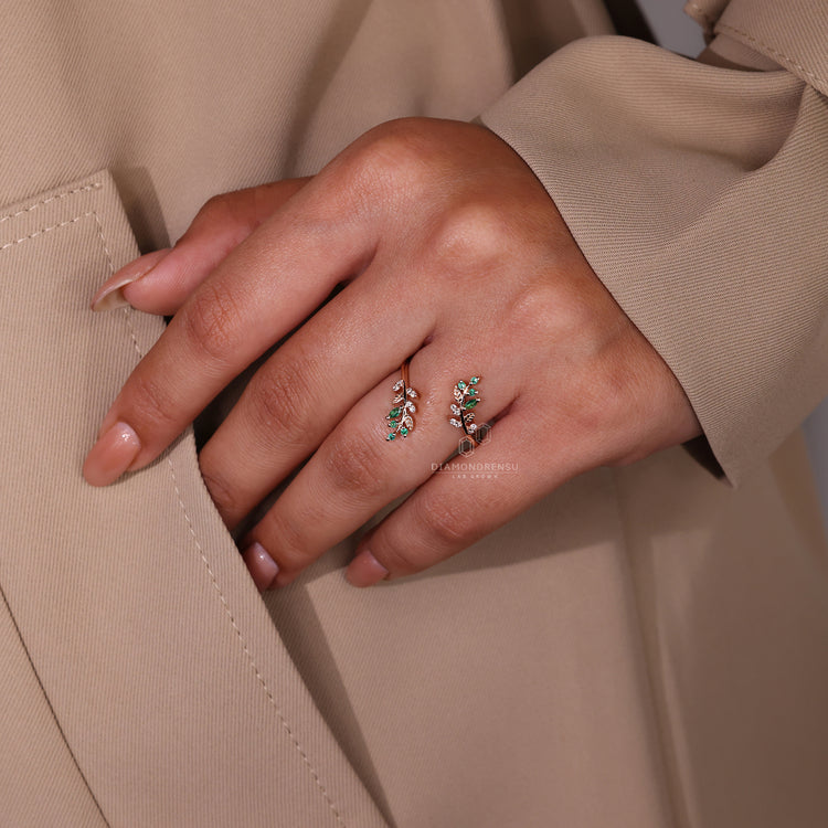 Prong set wedding band crafted with emerald and marquise diamonds.