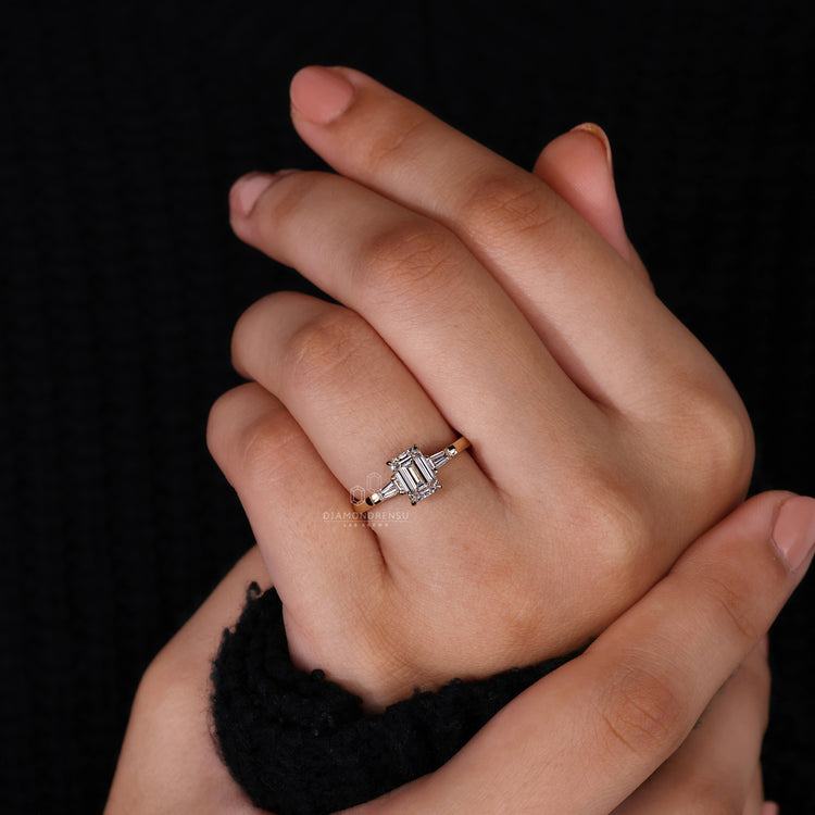 Yellow gold ring with emerald cut diamond and baguette sides from Diamondrensu UK.