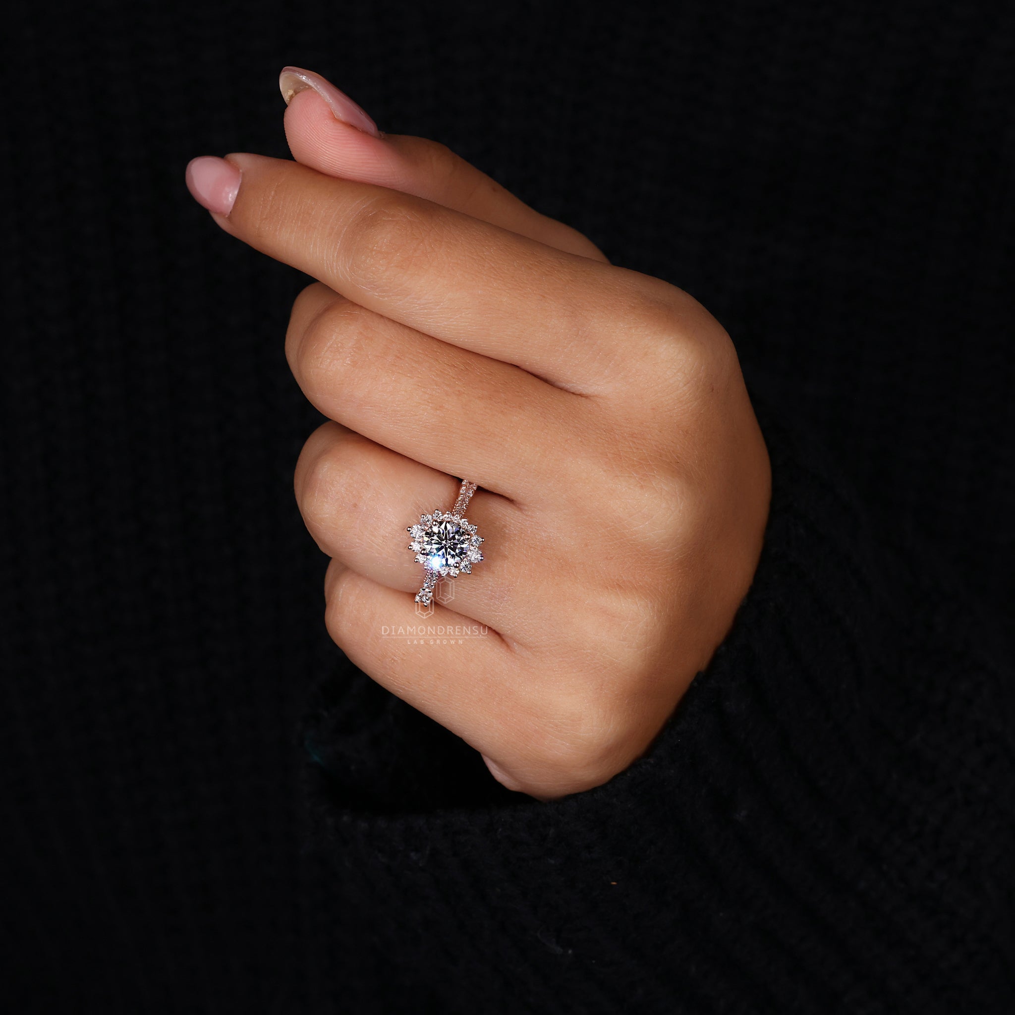 Unique engagement ring in rose gold with pavé accents.