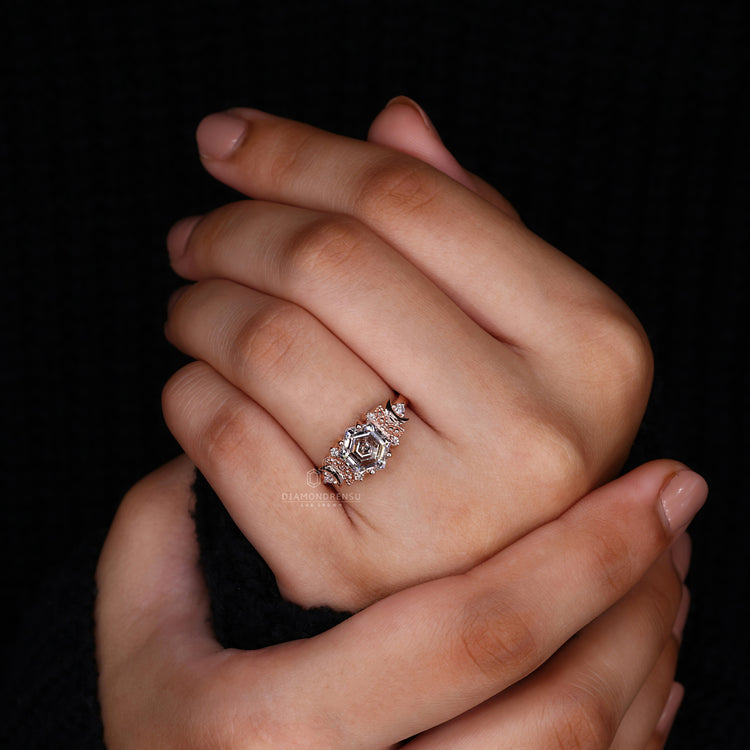 UK engagement ring made with round diamond side stone.