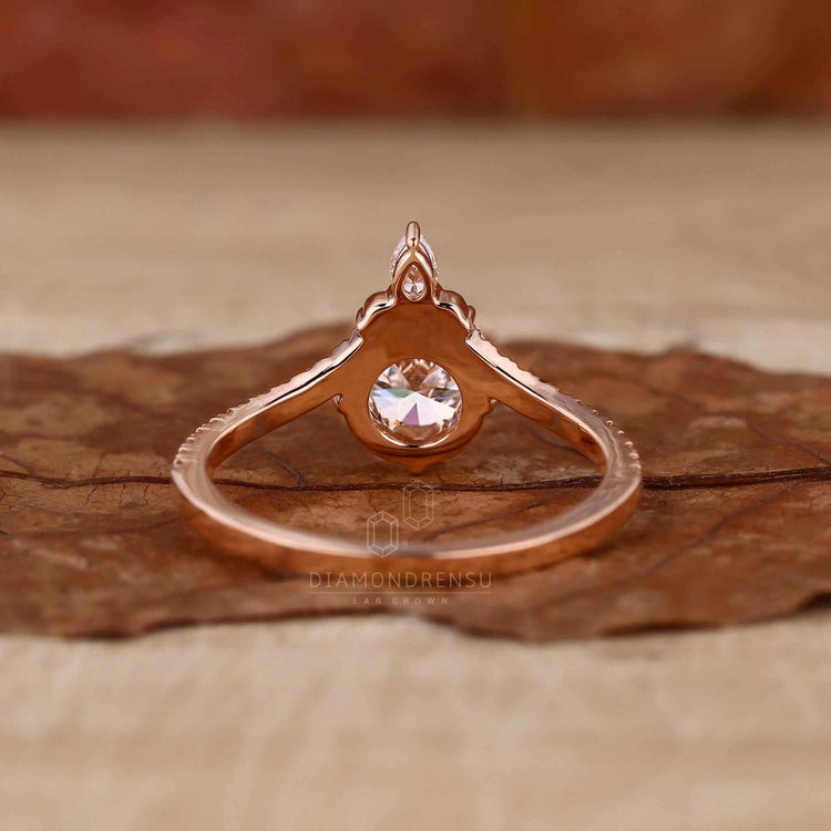 Pear cut engagement ring in a pave ring setting, perfect for women who love elegance.
