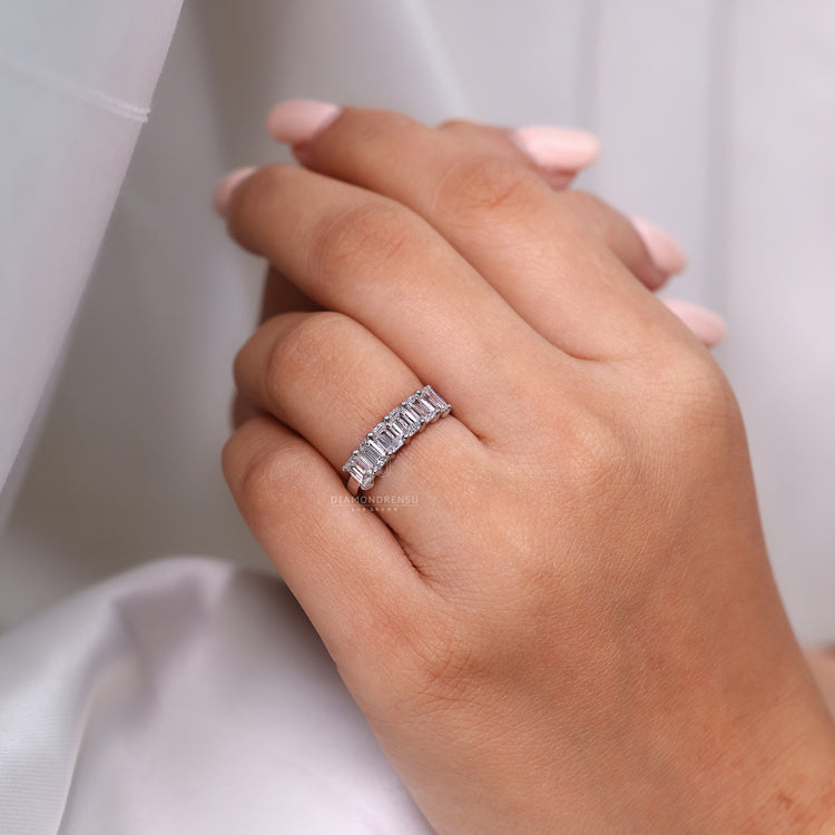 Half eternity wedding band with balanced design.