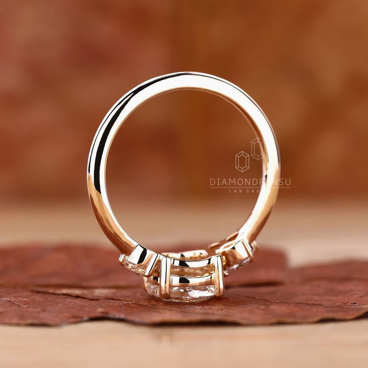 Unique engagement ring is made using yellow gold and muse ring.