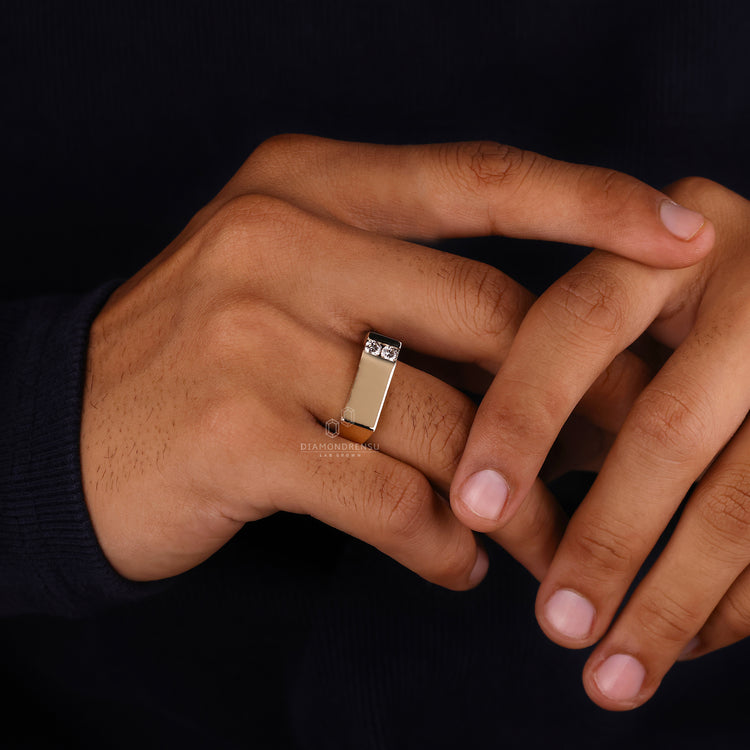 Yellow gold signet ring with handmade details and round diamonds.