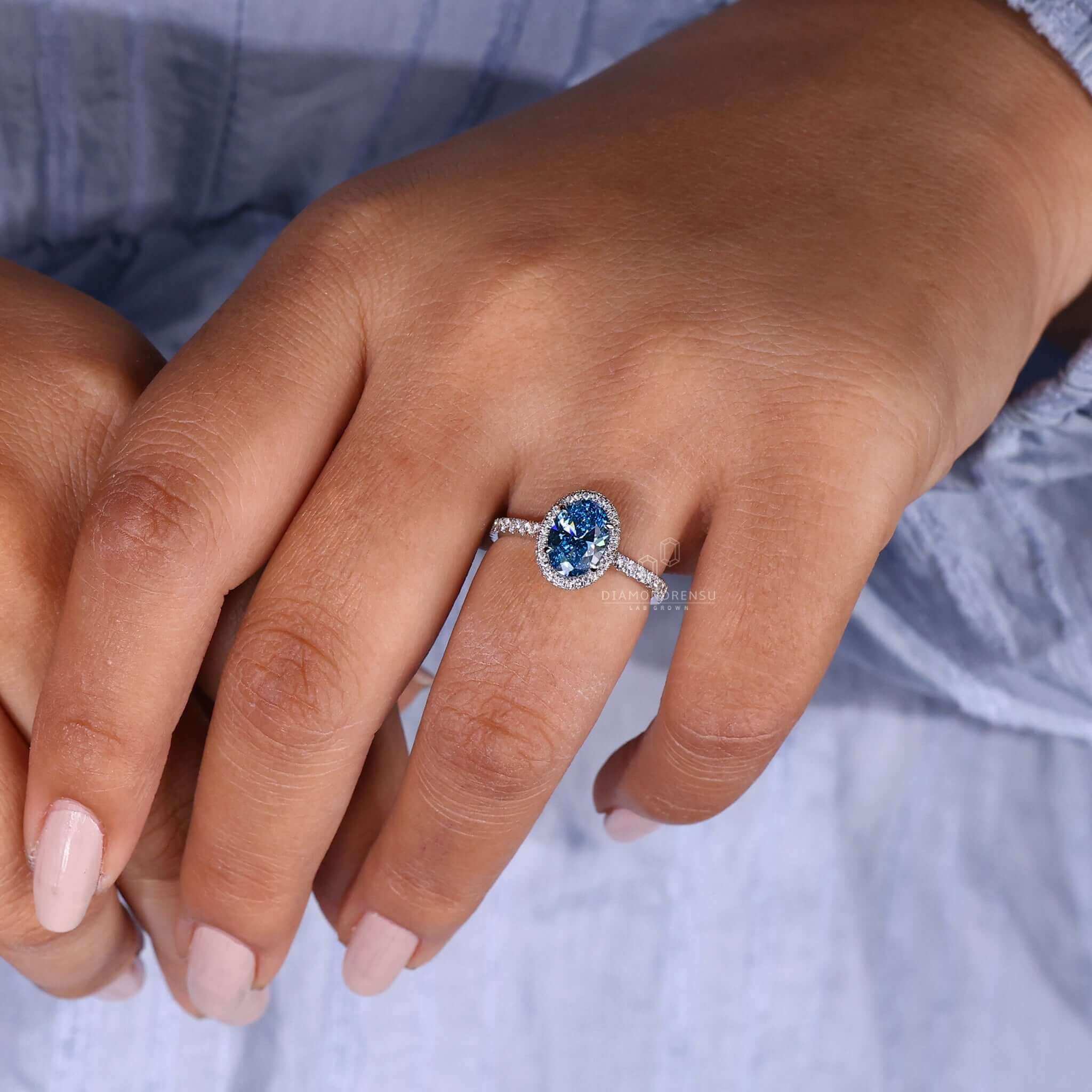 Oval engagement ring with side stones, perfect for creating a unique engagement ring style.