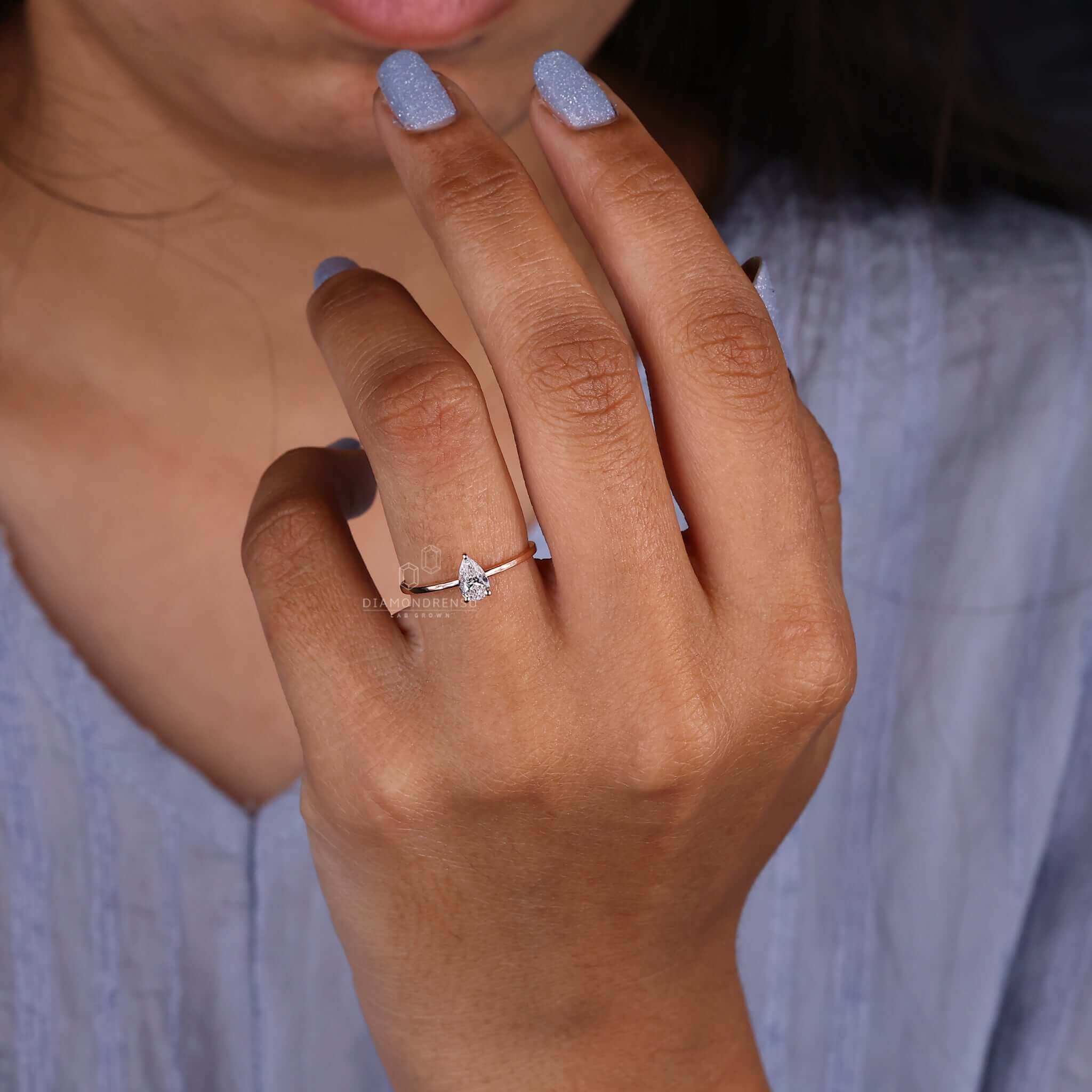 Solitaire diamond ring with a pear shape for a classic touch.