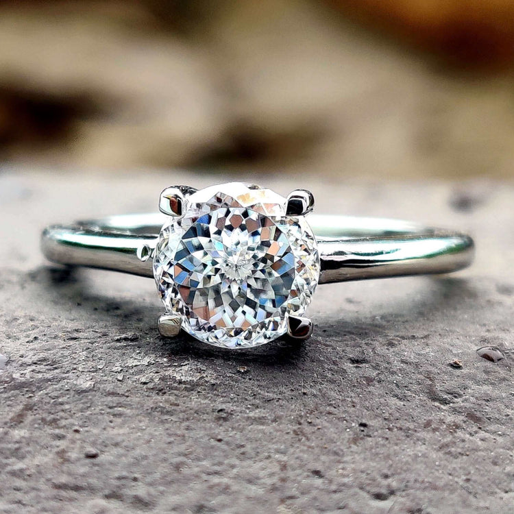 Portuguese cut solitaire engagement ring in white gold.