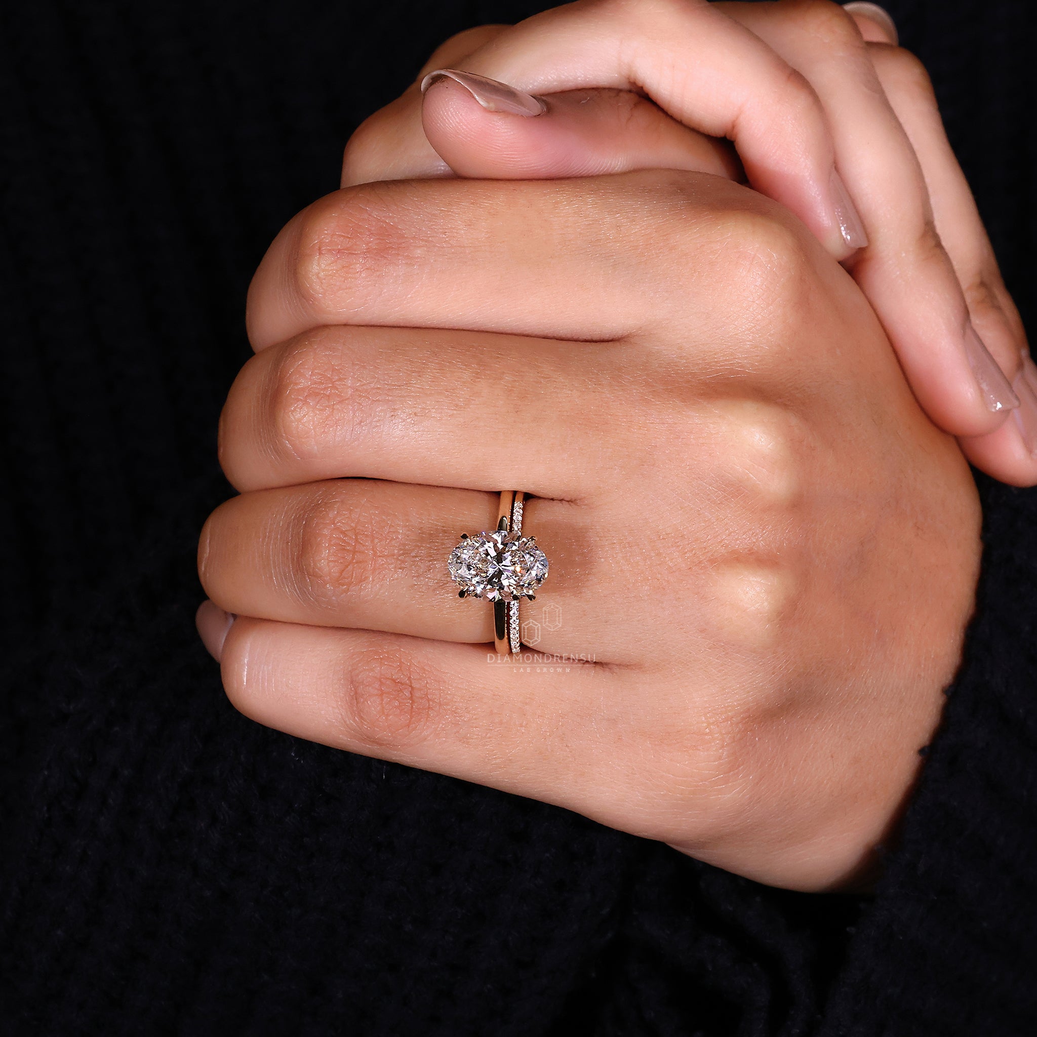 Oval diamond ring paired with round cut diamond band.