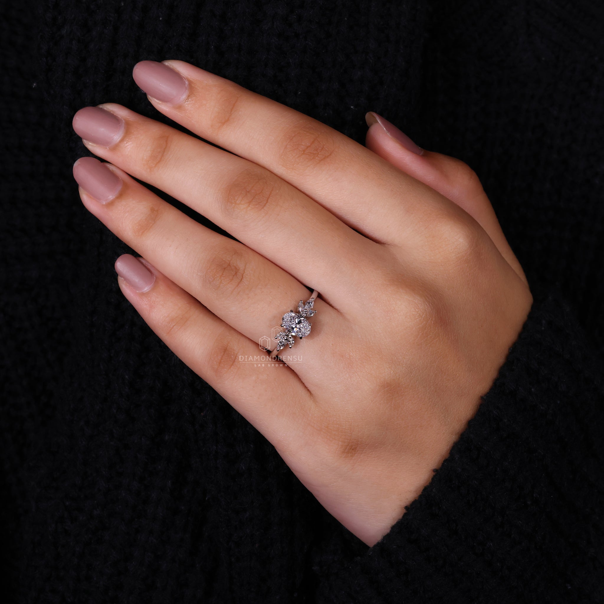 Engagement ring for women with a marquise cut diamond, perfect for a unique engagement ring with side stones.