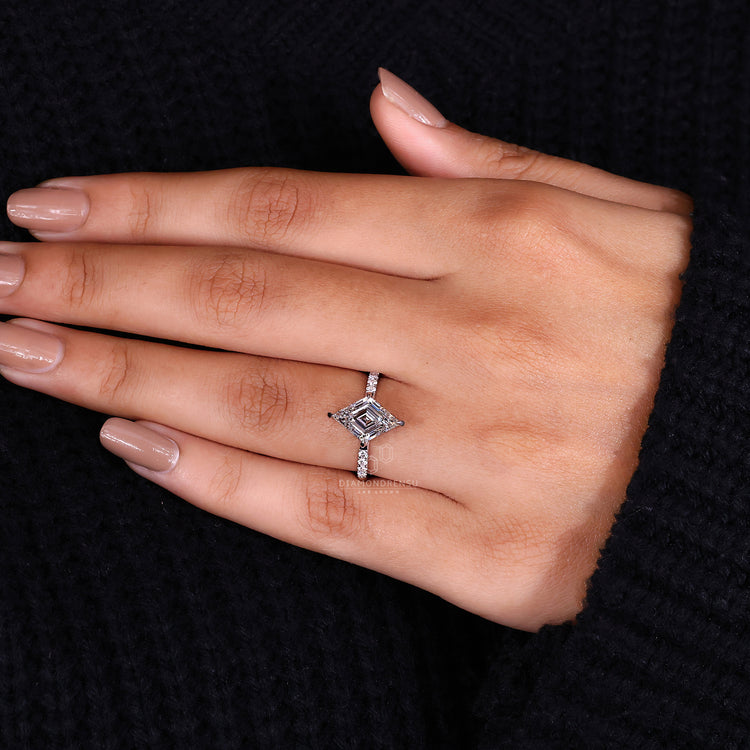 White gold ring with a pavé setting and lozenge cut diamond.