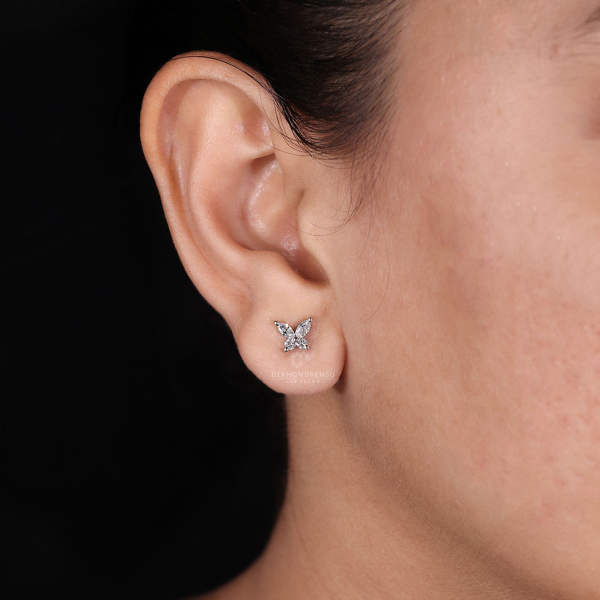 Round and marquise diamond studs.