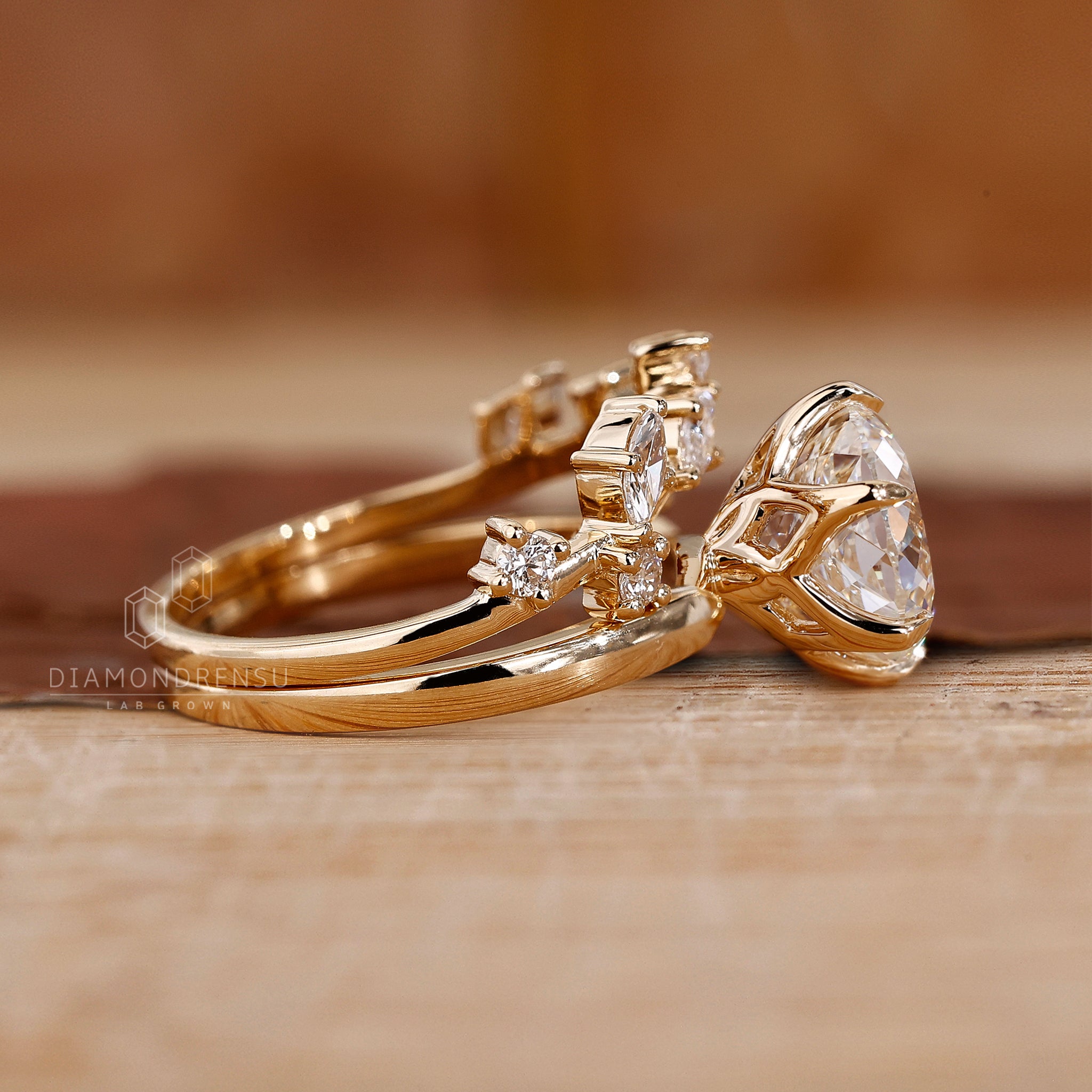 Handmade jewellery set with solitaire engagement ring and curved diamond band.
