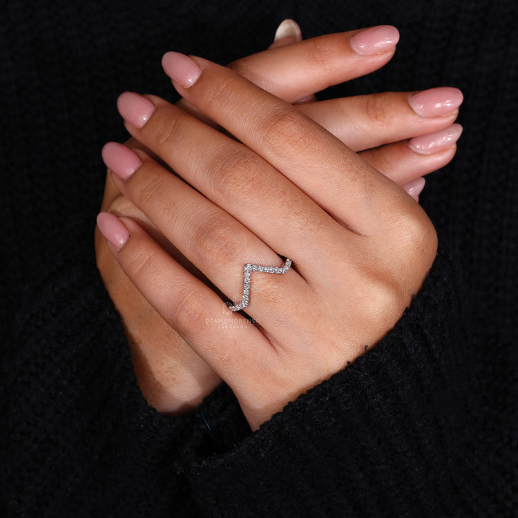 Half eternity diamond band with a clean v shaped curve.