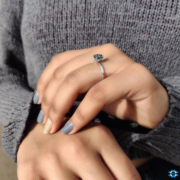 Prong setting ring with cyan blue moissanite ring