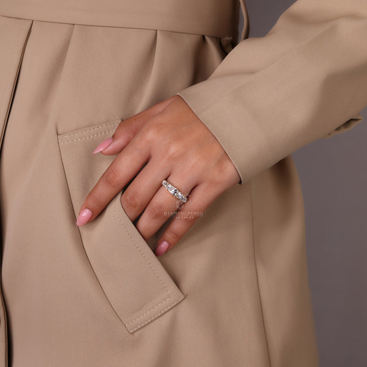 Custom diamond band featuring French cut diamonds and a sleek profile.