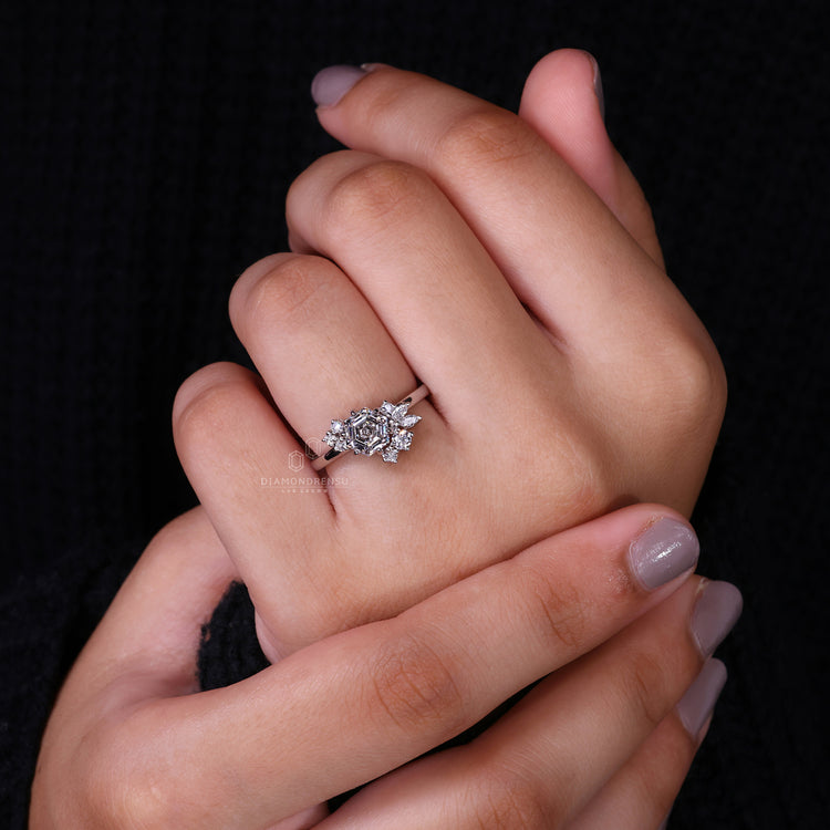 Marquise and Round side stone in cluster diamond ring.