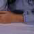 Woman wearing a diamond chain bracelet, sparkling under light. Woman wearing a diamond chain bracelet, sparkling under light.