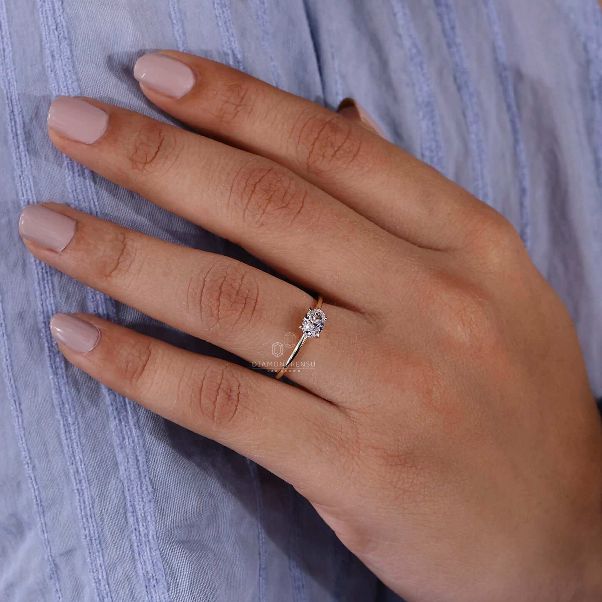 Diamond solitaire ring with a 4 prong claw setting, crafted as a bespoke handmade jewellery piece for engagements.