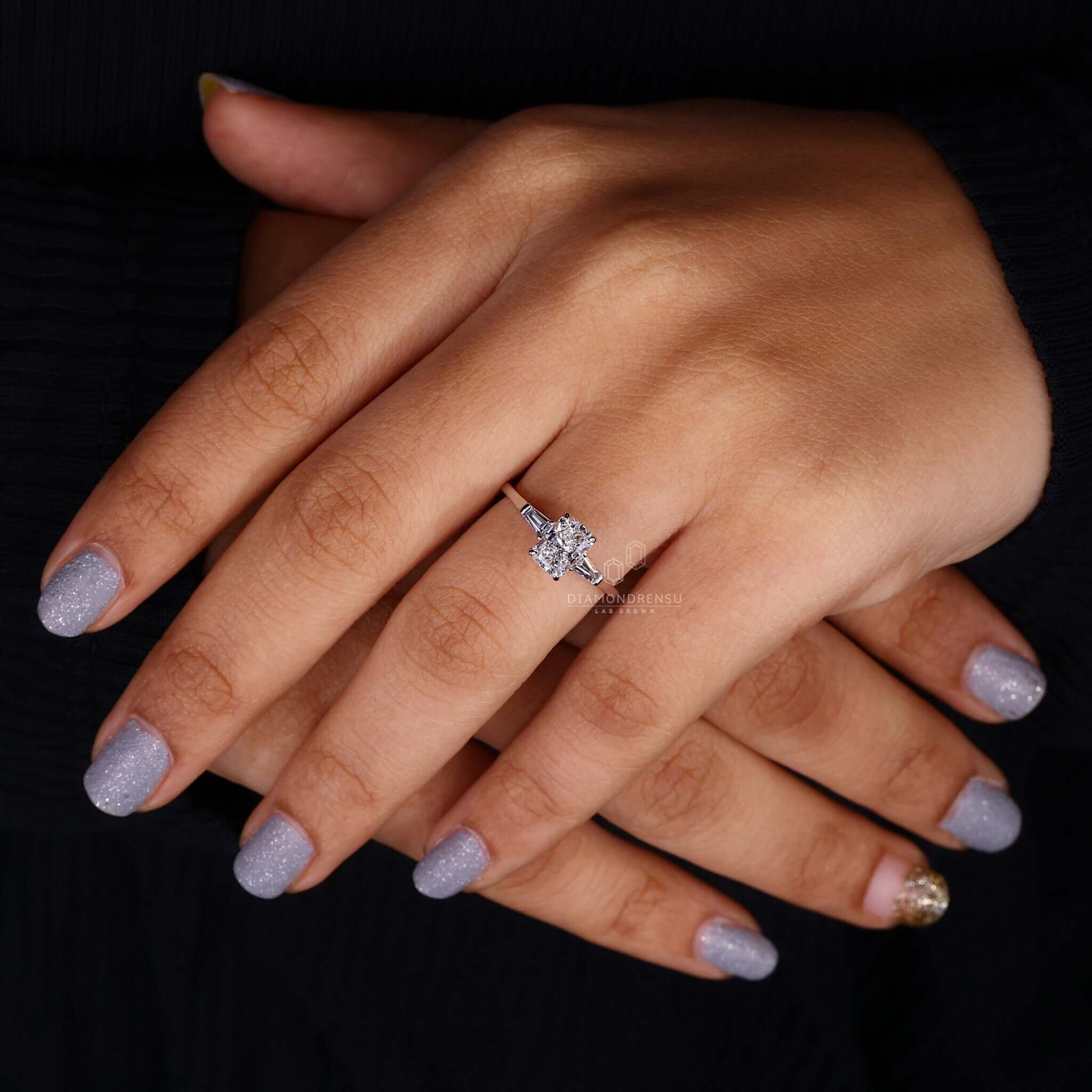 White gold engagement ring in a unique three stone setting.