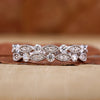 Milgrain wedding band with round diamond eternity design