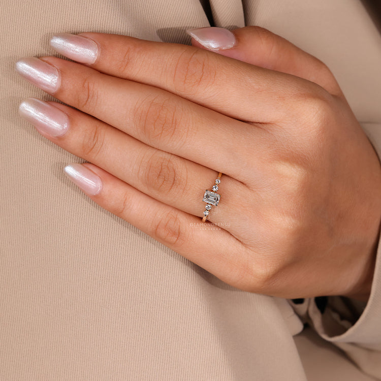 Yellow gold engagement ring with tapered band design.