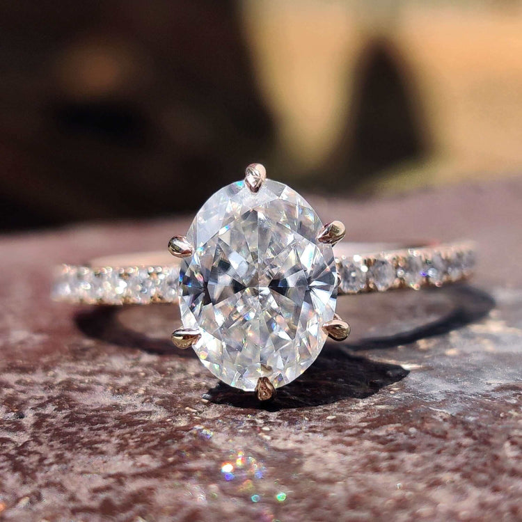 Oval moissanite ring with crushed ice oval cut stone.
