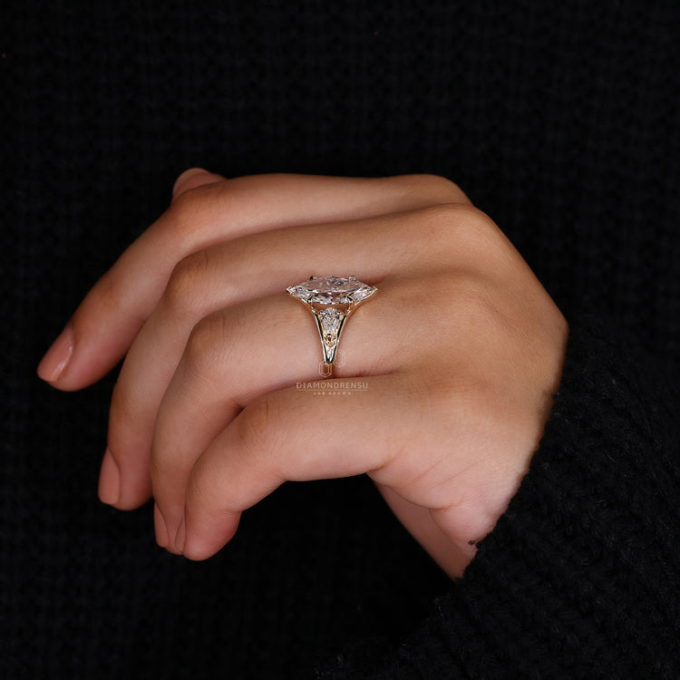 Yellow gold ring styled as 3 stone engagement ring.