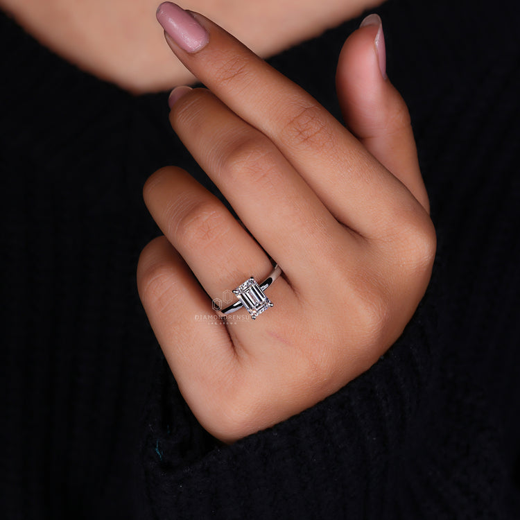 Round diamond ring paired with a sleek prong setting.