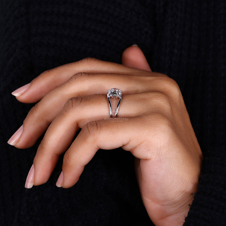 Split shank engagement ring paired with solitaire diamond ring.