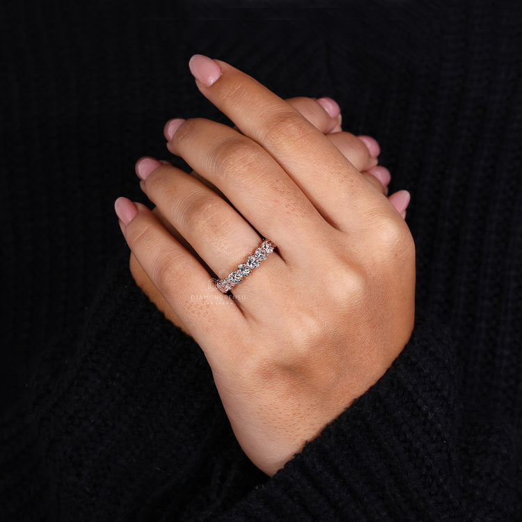 Rose gold wedding ring with heart diamonds.
