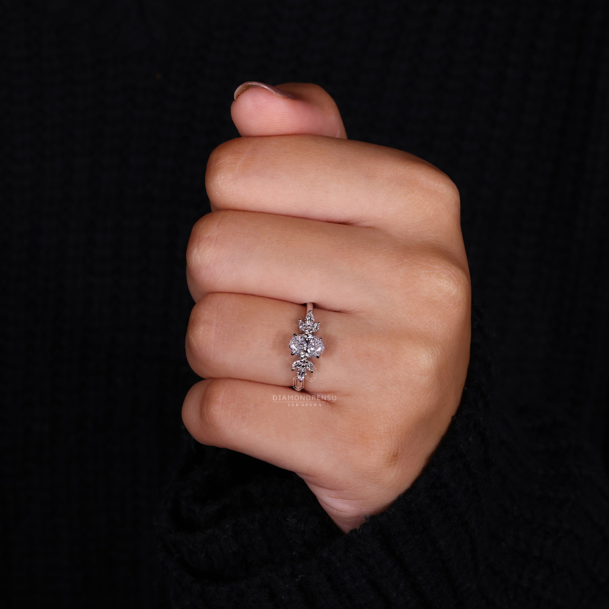 Oval engagement ring with a 4 prong claw setting and handmade ring design for a timeless diamondrensu UK ring.