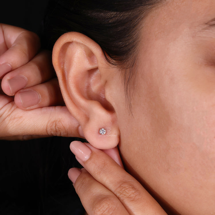 Rose gold 4 prong setting diamond earrings.
