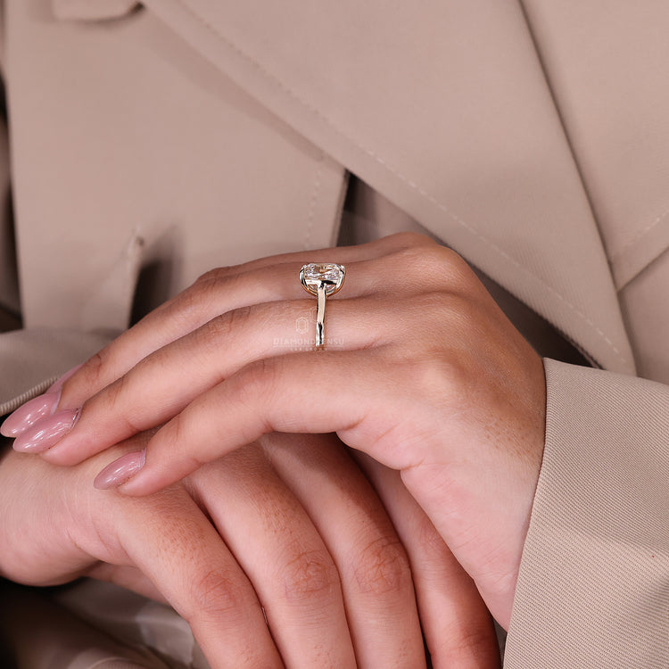 Unique engagement ring includes yellow gold with a cushion old mine cut.