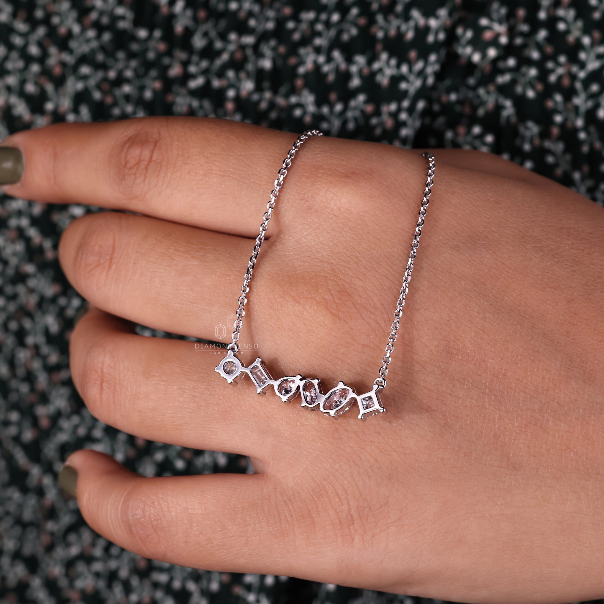 Handmade pendant crafted in white gold with mixed diamond shapes.