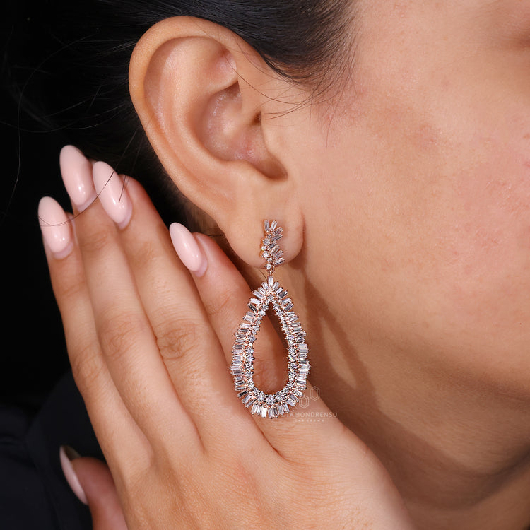 Rose gold earrings featuring baguette and round mix.