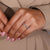 Round diamond band with shared prong Round diamond band with shared prong