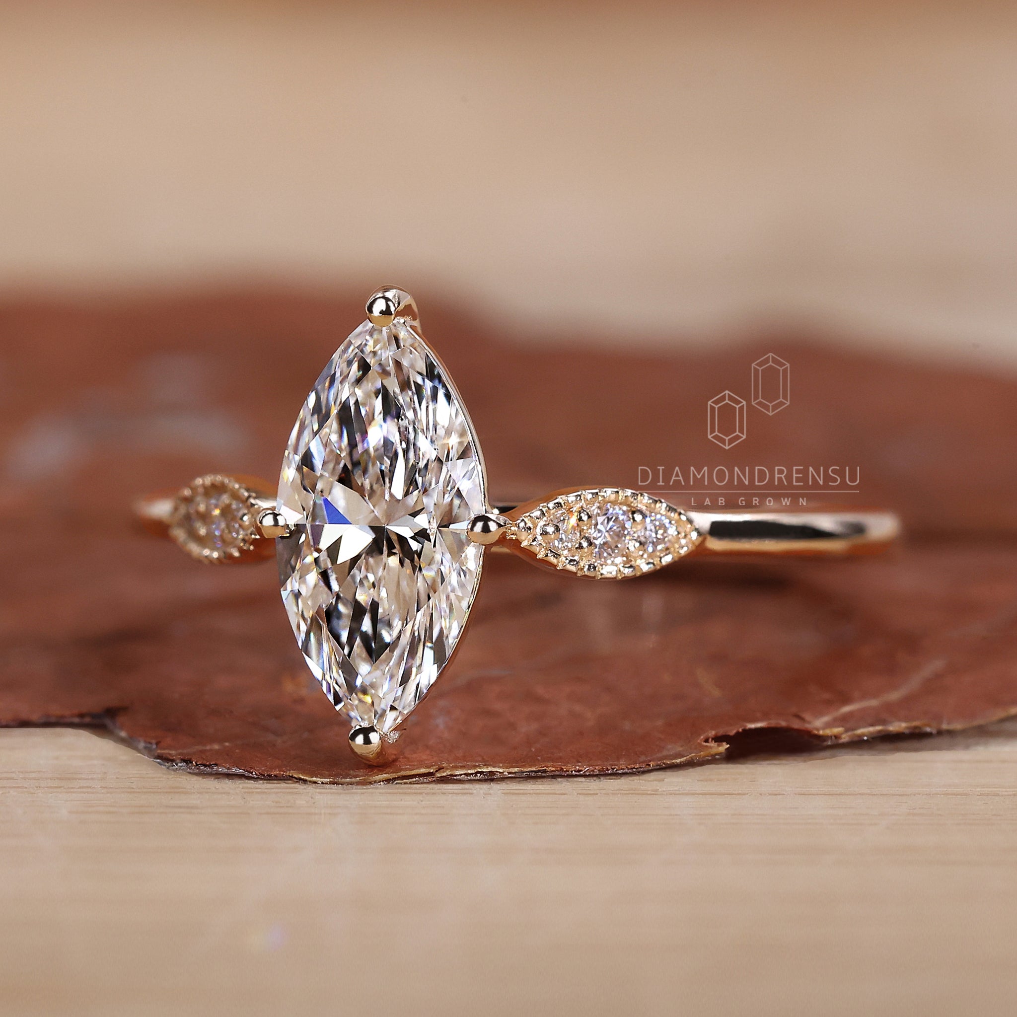 Marquise outline with round diamond center.