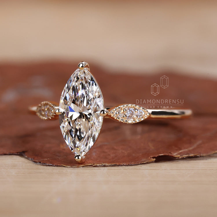 Marquise outline with round diamond center.