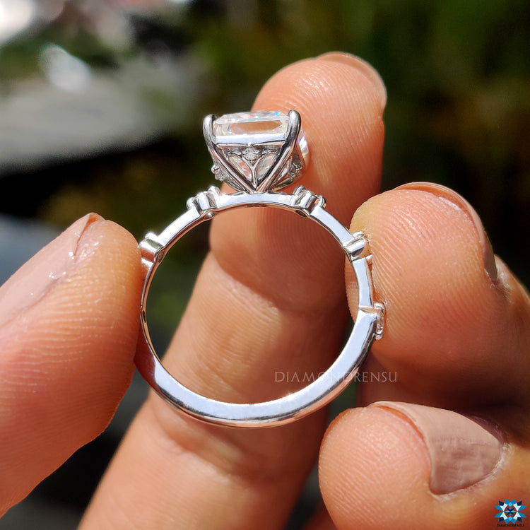 Custom engagement ring featuring radiant Rensu moissanite and round pave accents.