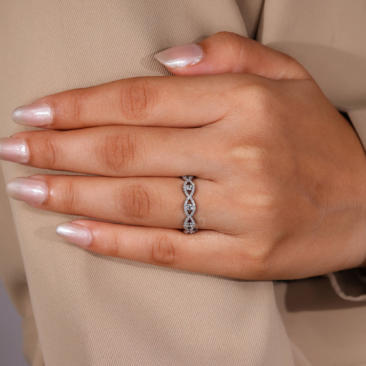 White gold wedding band with round lab grown diamonds.