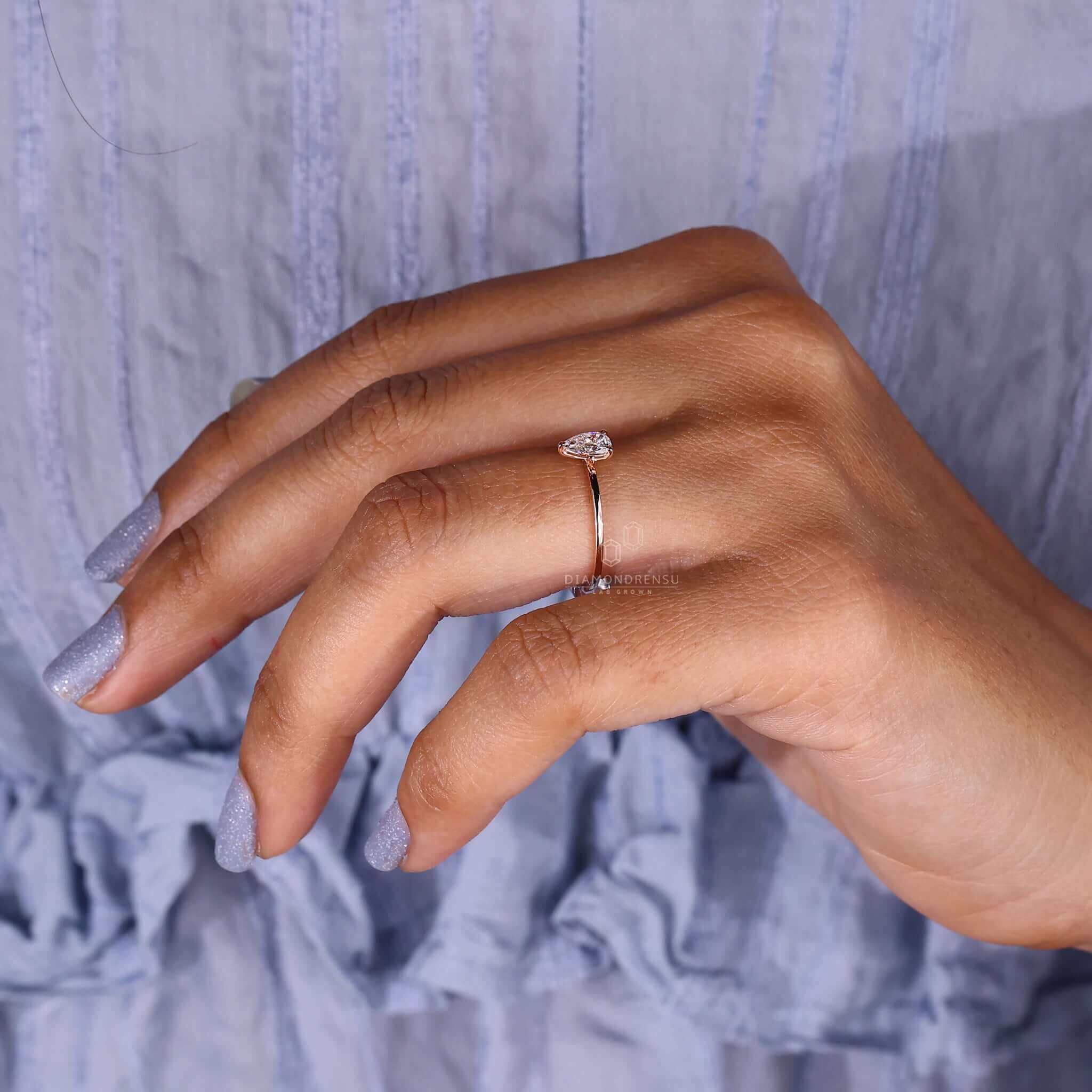 IGI certified pear drop engagement ring for a timeless look.