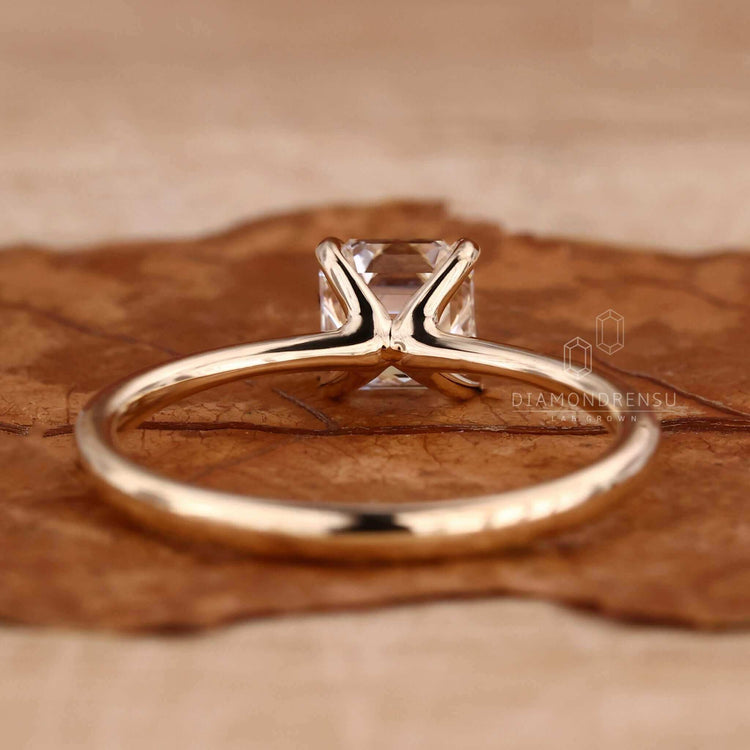 Asscher cut diamond ring with a classic design, perfect for engagements or anniversaries.