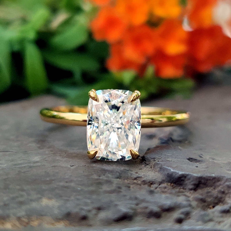 Elongated cushion cut moissanite ring in white gold.