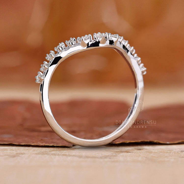 Lab diamond wedding band with curved design.