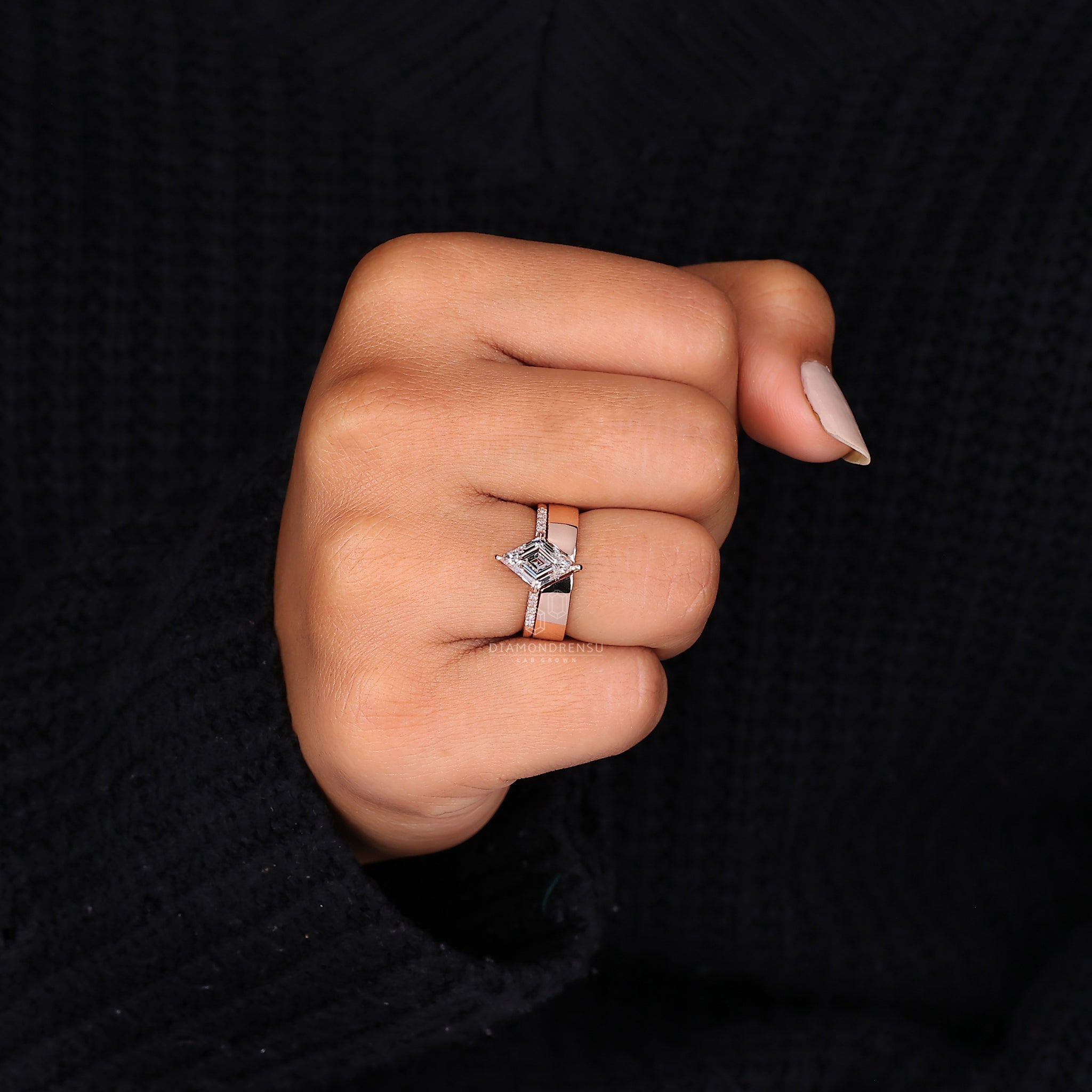 Unique bridal set featuring lozenge cut ring and curved open band.