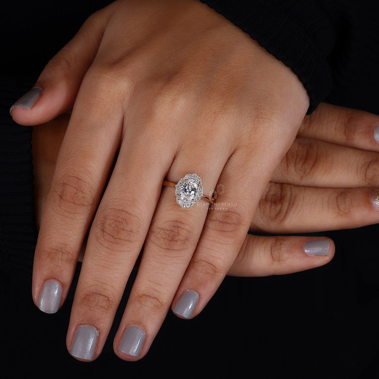 Oval halo ring featuring a radiant diamond encircled by a sparkling halo.