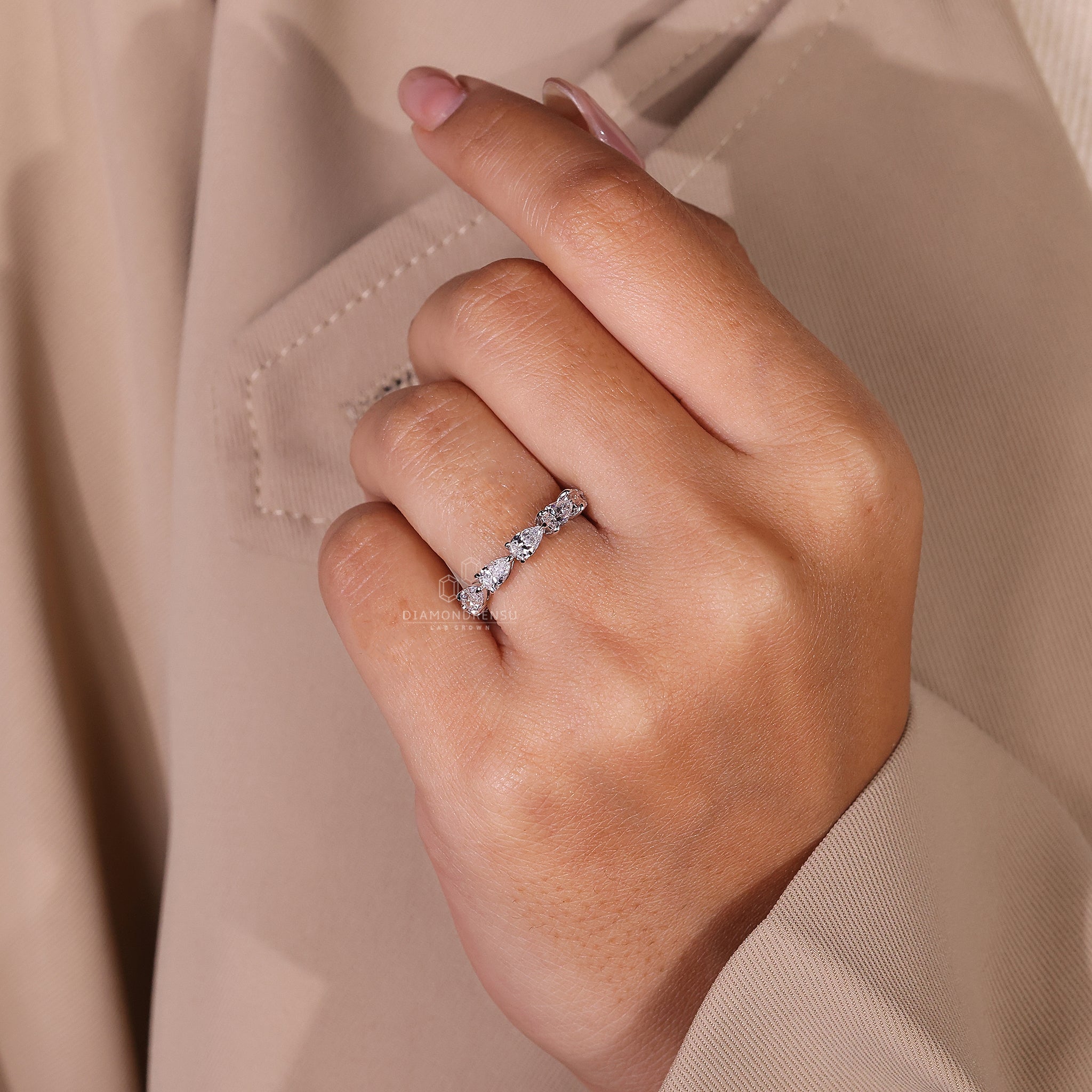 Handmade pear diamond wedding ring.