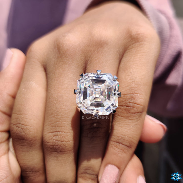 Handmade jewellery ring featuring Asscher cut moissanite and pave details.