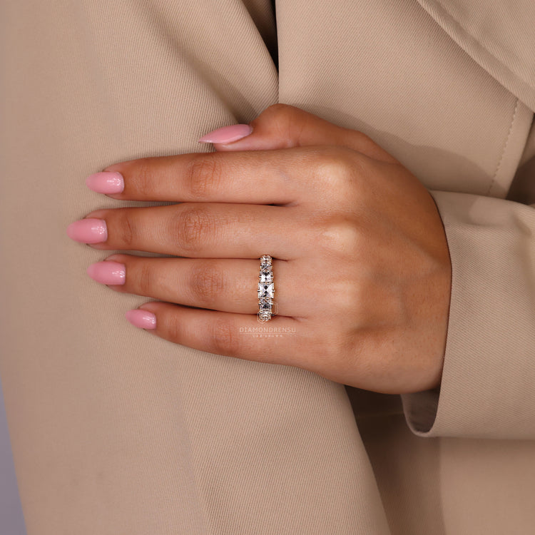 Handmade band in yellow gold showcasing French cut diamonds.